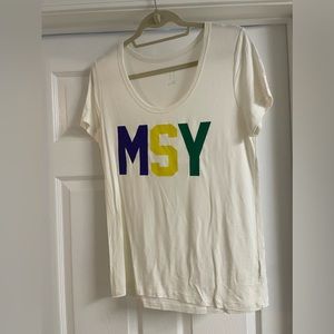 A new Day MSY airport printed Mardi Gras graphic shirt